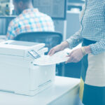 woman office printer photocopier paper jam