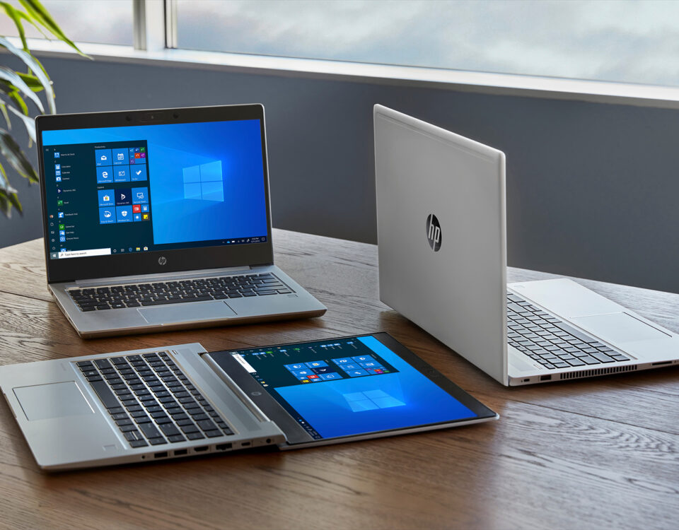 hp laptops on wood office table imaging services