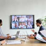 conference room meeting television video call camera desk