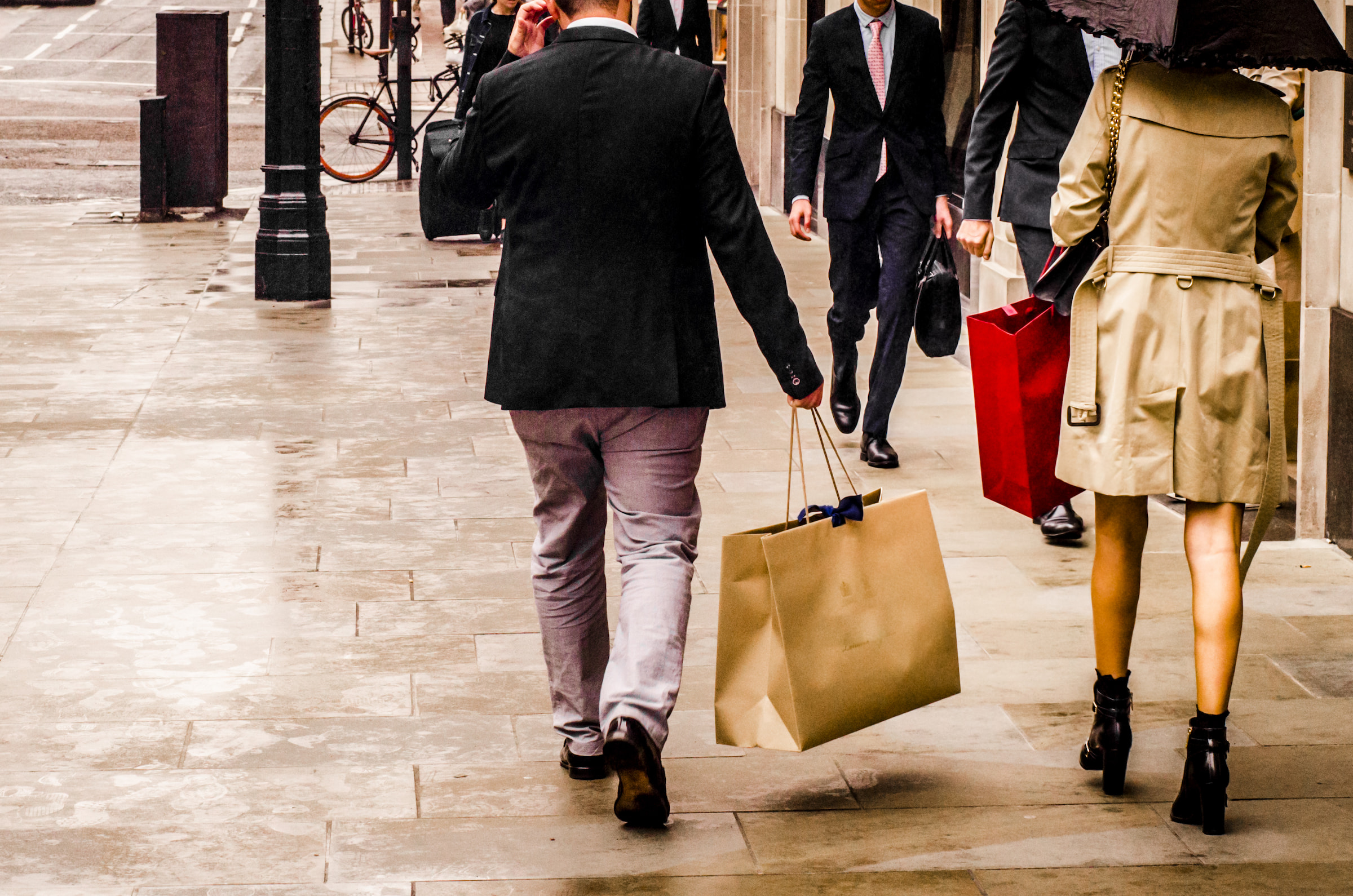 people shopping in upper class London rain