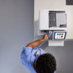medical professional using printer photocopier grey