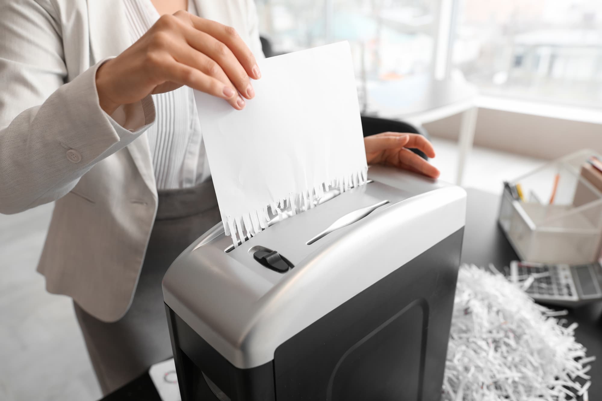 paper being compliantly shredded post digitisation