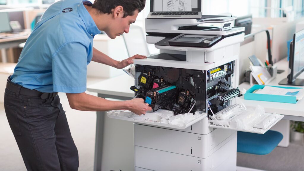 apogee engineer replacing printer toner
