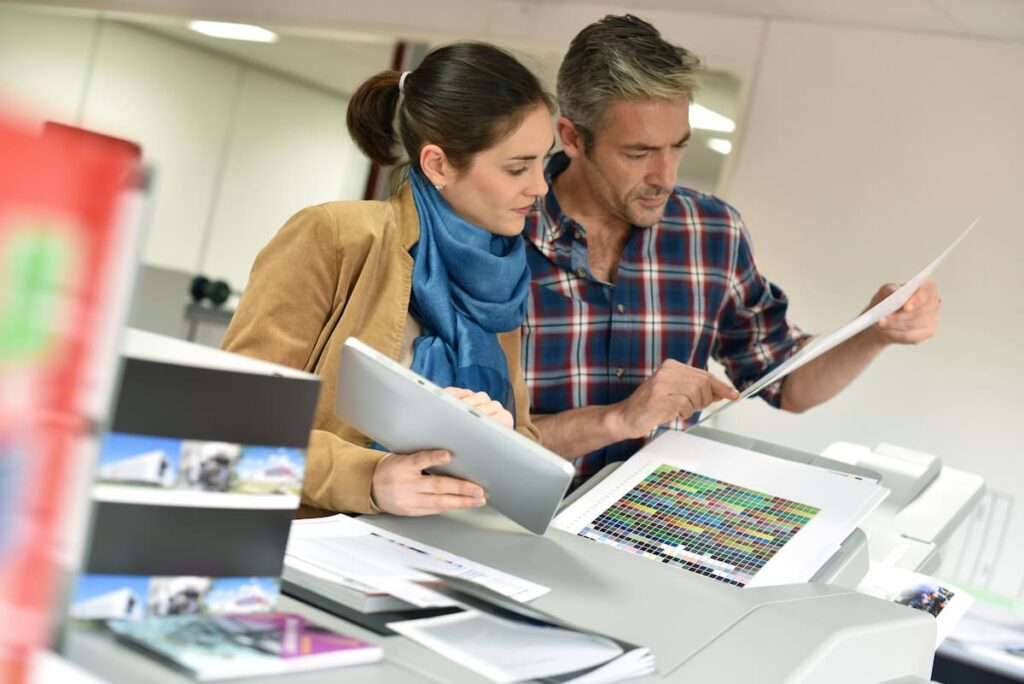 Production Print magnifying glass over photos