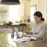 woman working from home remotely HP laptop
