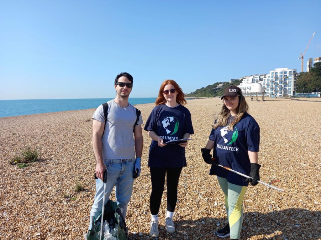 Three Apogee volunteers at Folkestone Beach Clean 2023 