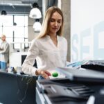 Woman uses printer in office