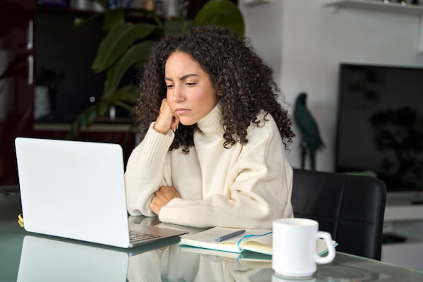 hybrid work location woman looking frustrated in home office