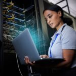 young asian woman apprentice using laptop