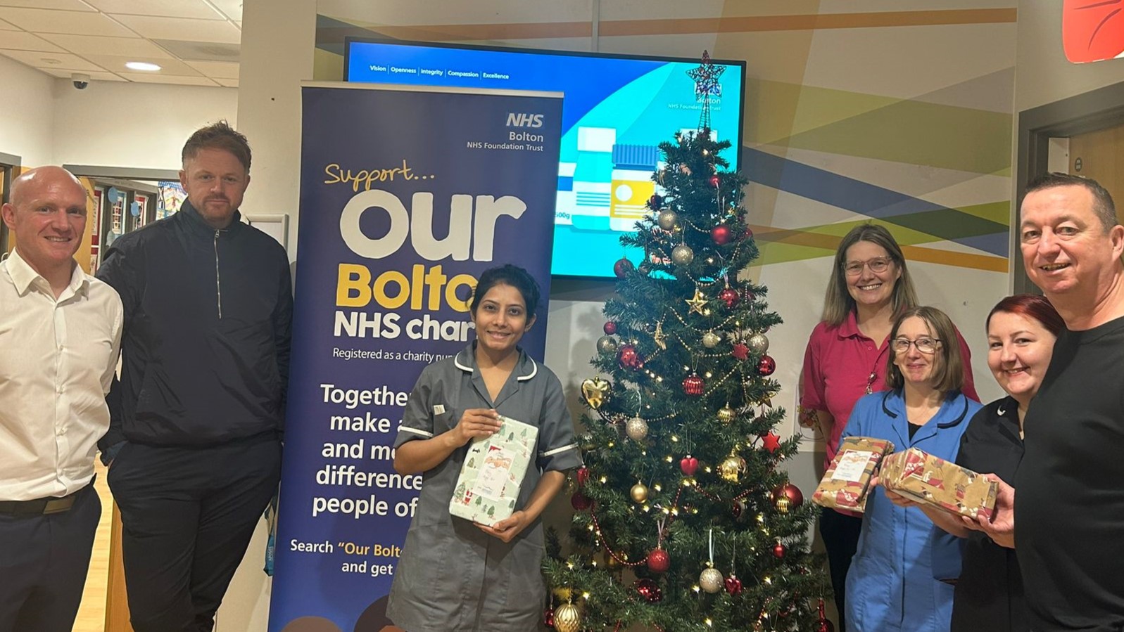 apogee employees deliver presents to our bolton