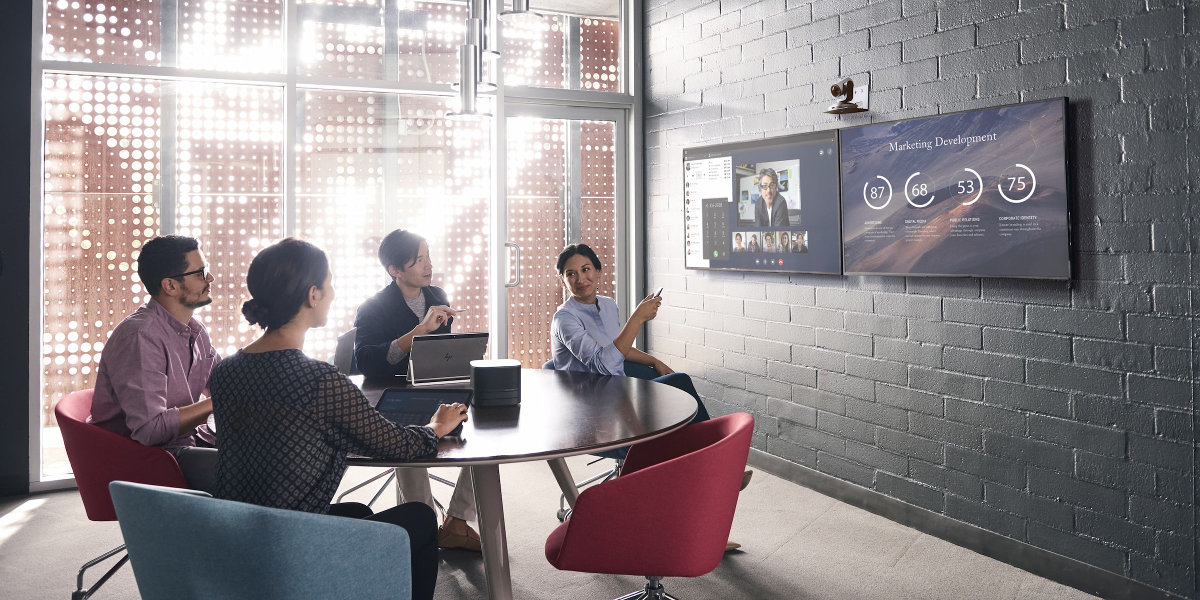 conference room stone wall video meeting round table