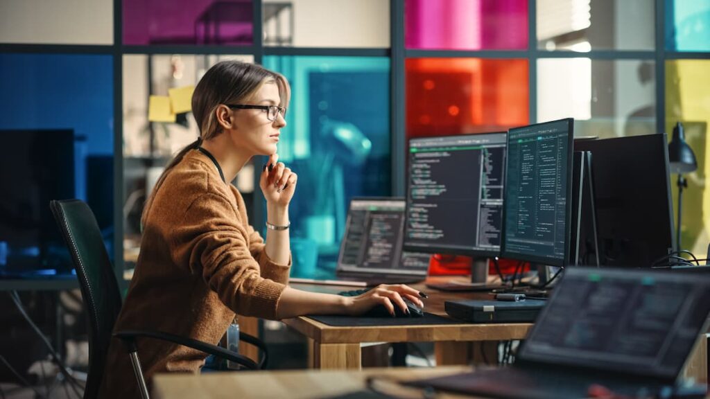 woman using computers in data centre managed it services