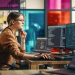 woman using computers in data centre managed it services