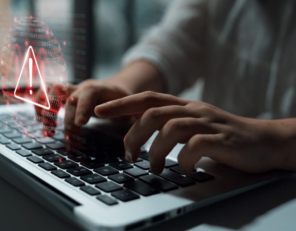 cyber security laptop with red warning error work at home hybrid working
