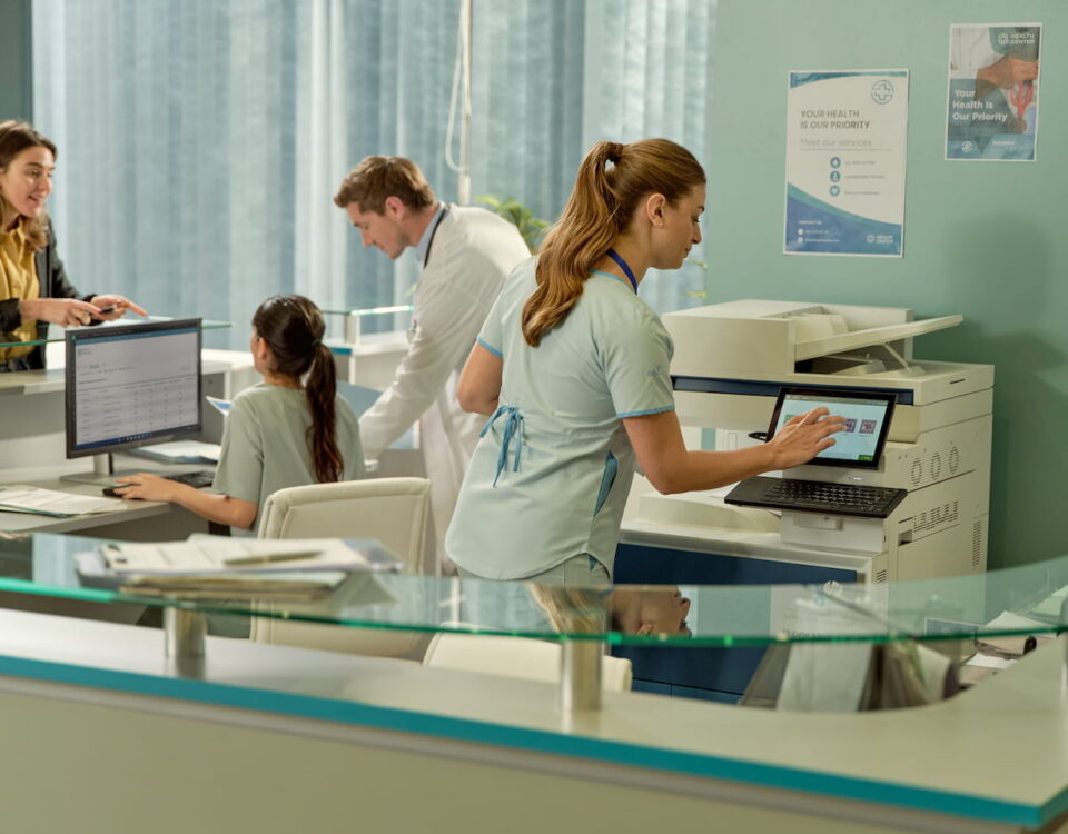 nhs healthcare worker using photocopier printer